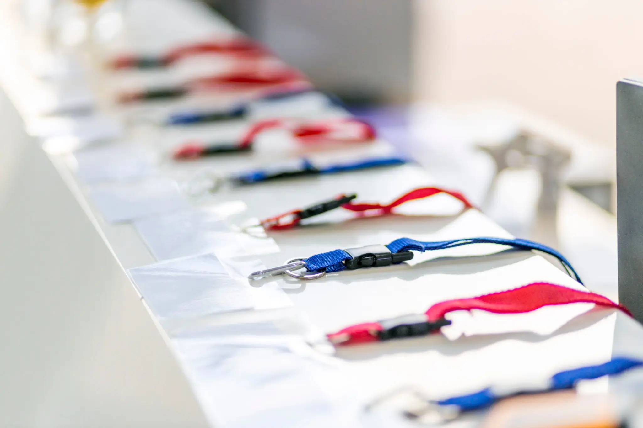 Colorful lanyards lined up for event